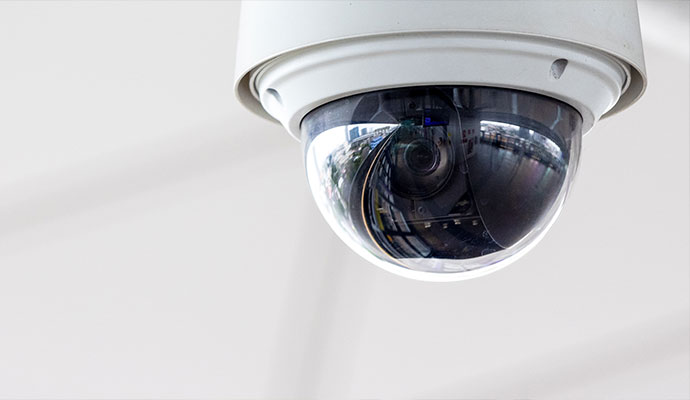 Dome security camera on a white ceiling