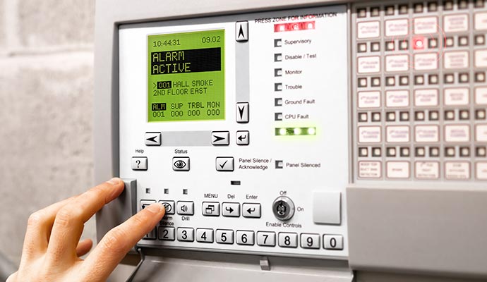 Person activating a fire detection system