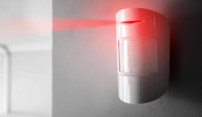 Motion sensor device installed on interior wall