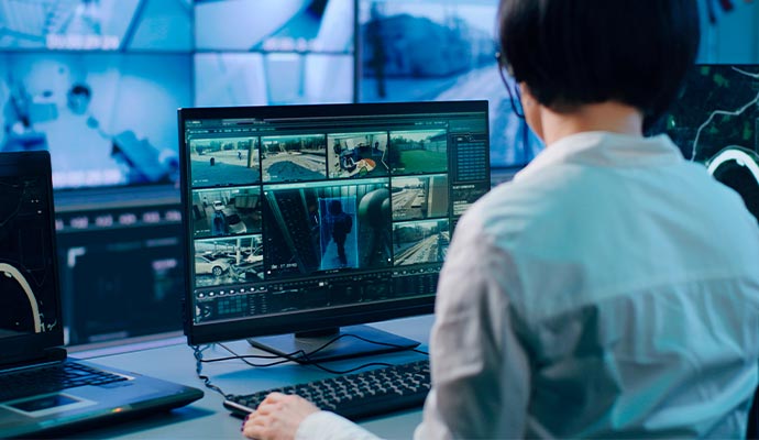 Person monitoring real time video footage on smart device