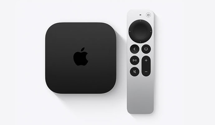 An overhead view of a black Apple TV 4K streaming box and its sleek silver Siri Remote on a clean white background