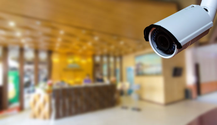 Security camera installed inside a commercial property monitoring the reception area